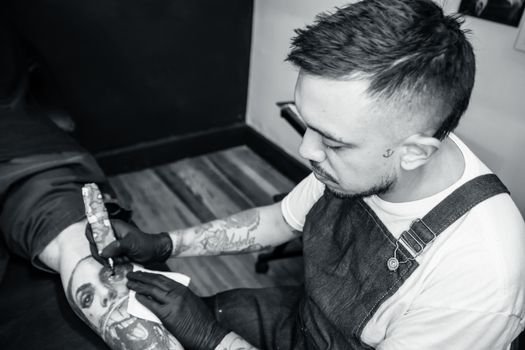 Bob Price sketching a custom tattoo design for a client