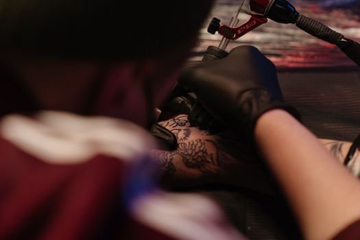 Bob Price sketching a custom tattoo design for a client